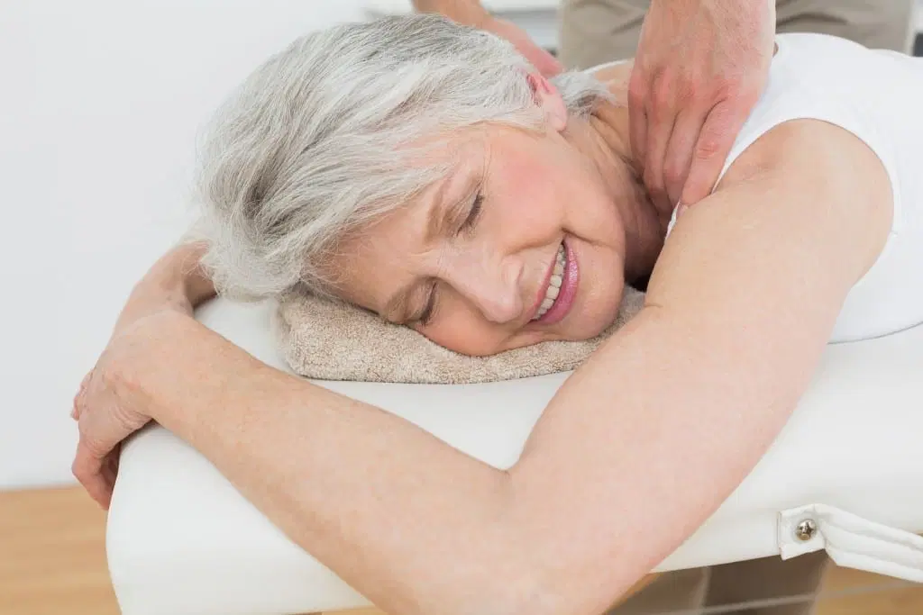 Image of an elderly woman getting a massage