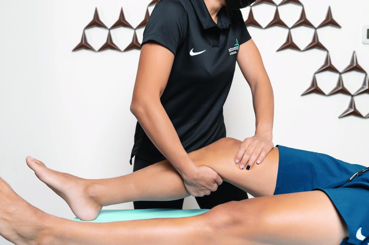 Image of a therapist giving a man a sports massage